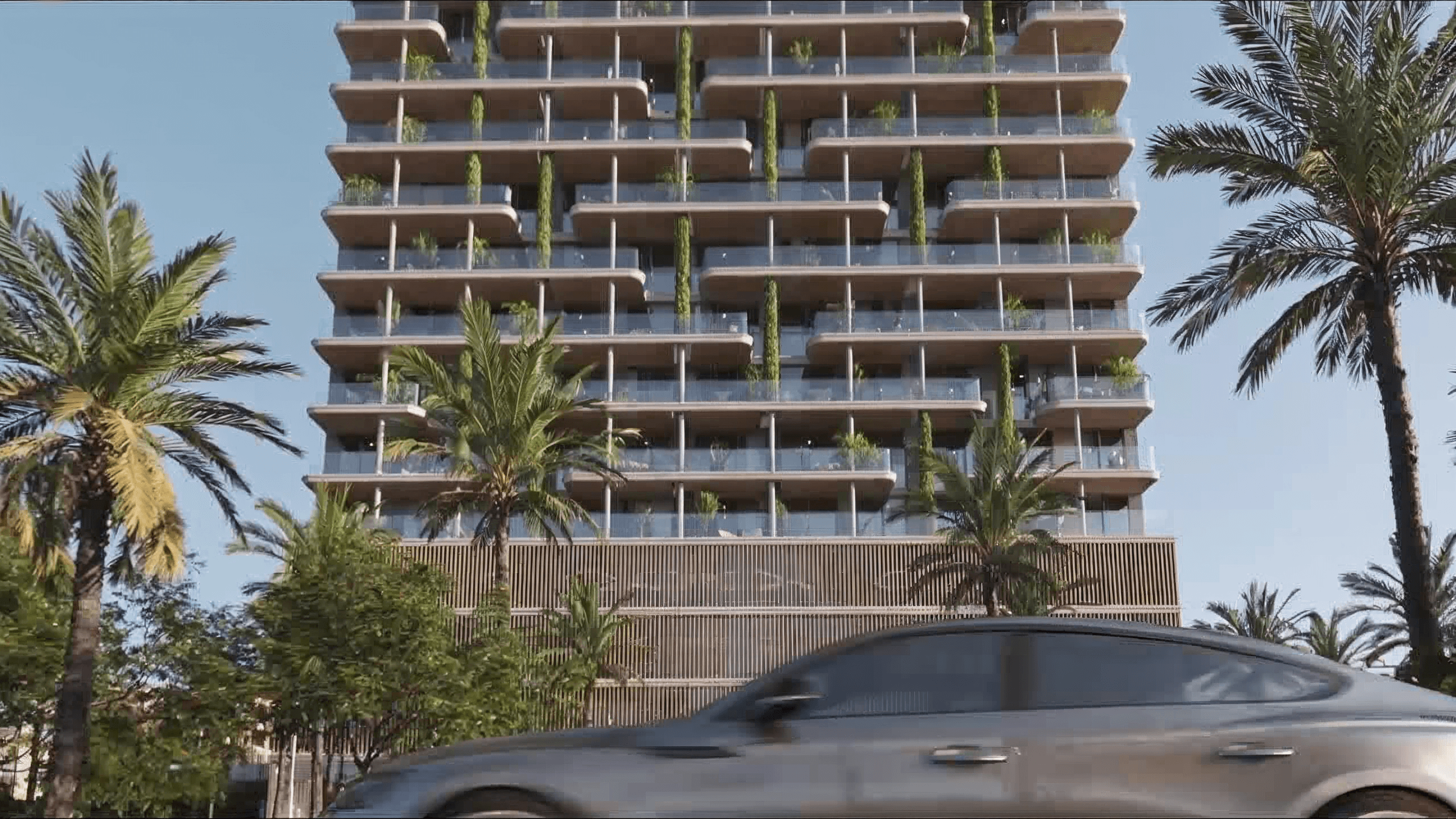 Exterior view of the residential tower with landscaped balconies